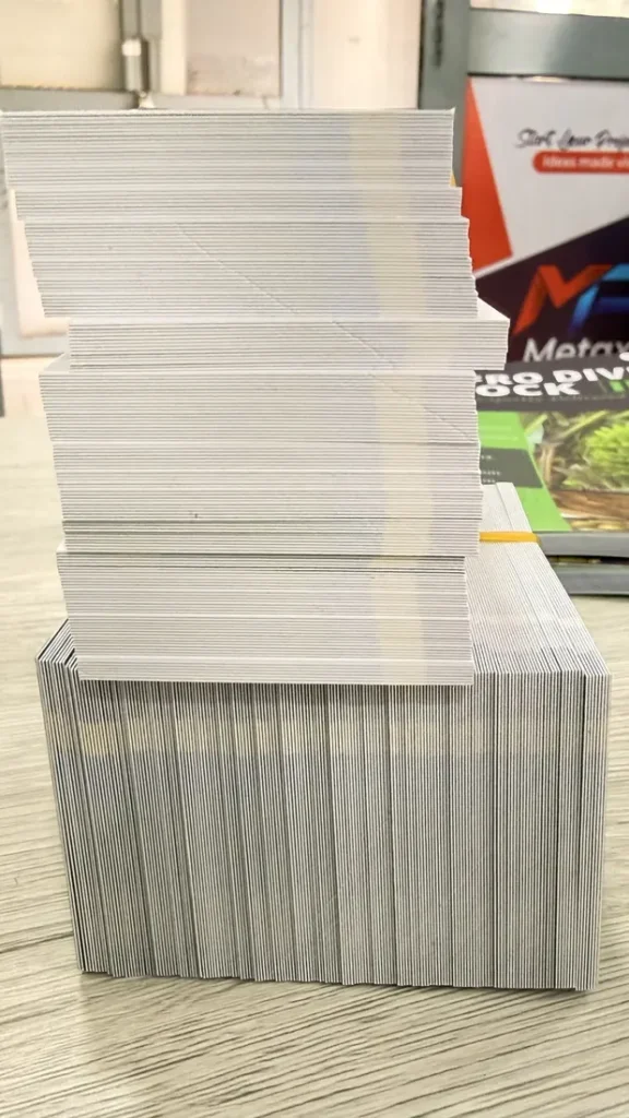 Stacks of cut business cards showing the card edge